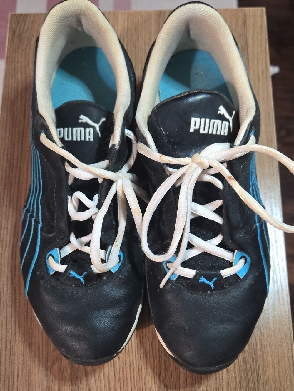 Puma Black Sneakers with Blue Accents and White Laces